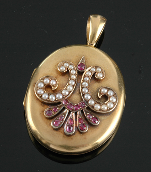 Appraisal: An Antique ruby and seed pearl locket Having applied decoration