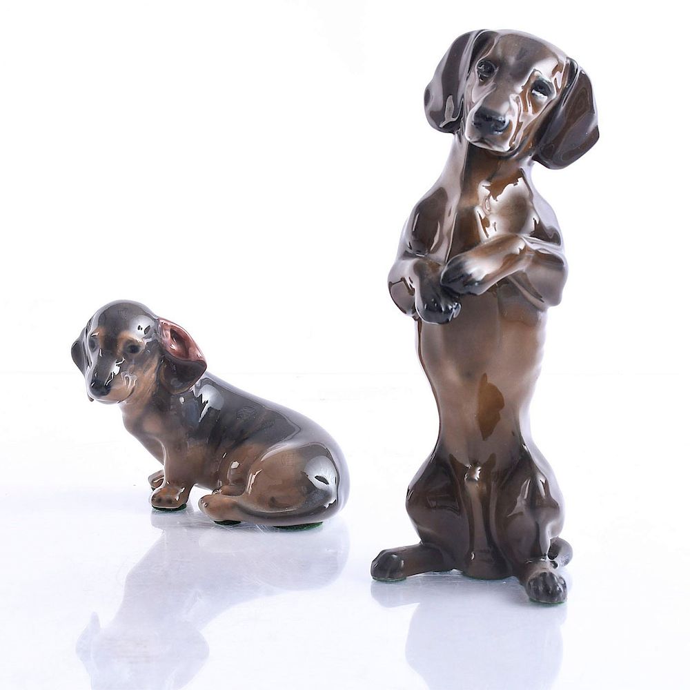 Appraisal: DACHSHUND CERAMIC DOG FIGURINES Royal Copenhagen and Rosenthal Backstamps on