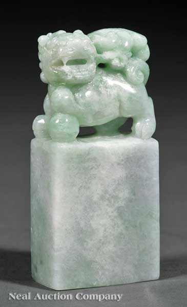 Appraisal: A Chinese Carved Jadeite Seal Stone rectangular form surmounted with