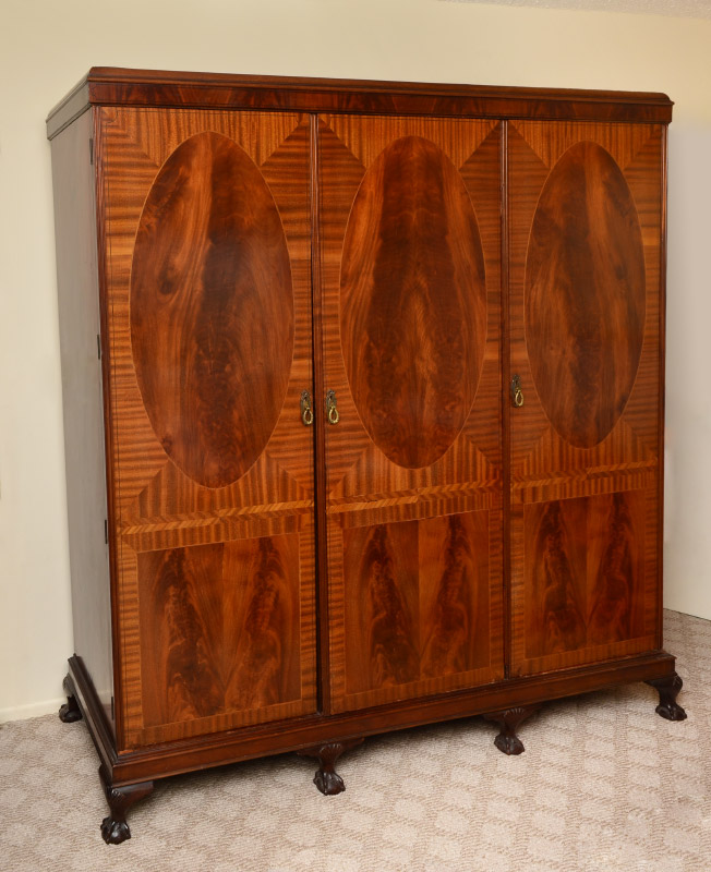 Appraisal: TRIPLE DOOR MAHOGANY INLAID ARMOIRE Three blind doors each with