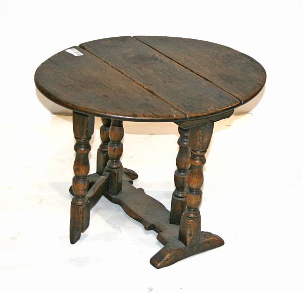 Appraisal: A Baroque style oak gate leg table composed of antique