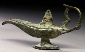 Appraisal: ANCIENT PERSIAN OIL LAMP Small and ancient covered Persian bronze