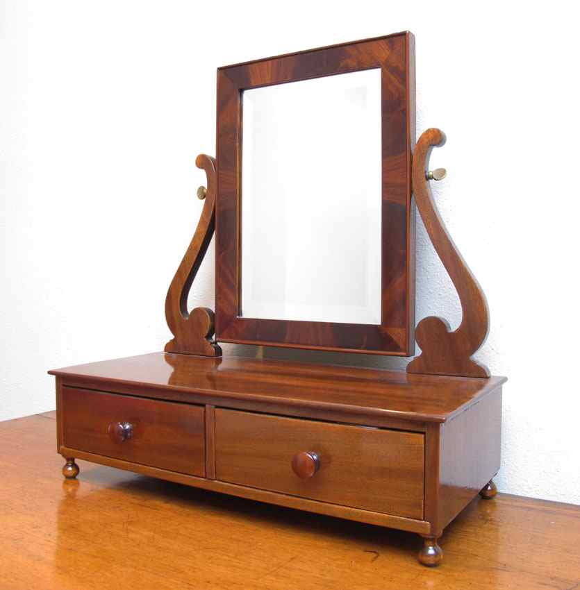 Appraisal: MAHOGANY SHAVING MIRROR Late th C Beveled mirror over drawer