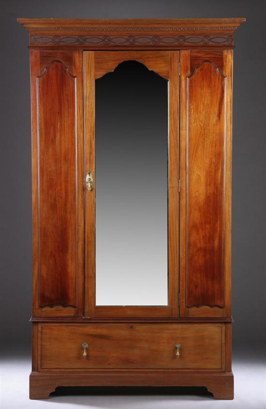 Appraisal: VICTORIAN CARVED MAHOGANY MIRRORED WARDROBE th Century Mirrored door over