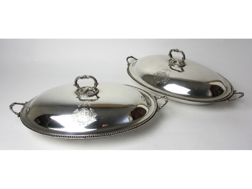 Appraisal: A pair of Victorian silver entree dishes of oval form