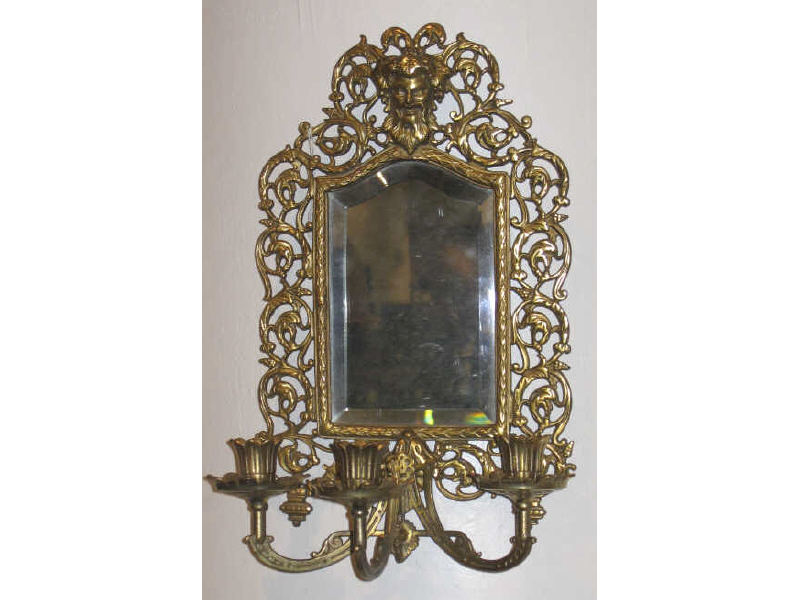 Appraisal: BRADLEY AND HUBBARD MIRRORED SCONCE A patinated cast metal floral