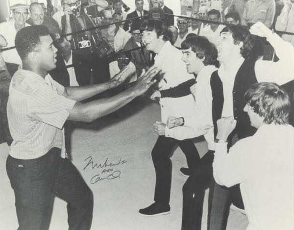 Appraisal: MUHAMMAD ALI AND THE BEATLES AUTOGRAPHED PHOTOGRAPH x sight size