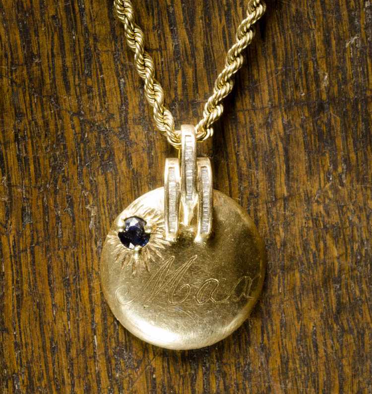 Appraisal: SAPPHIRE AND FOURTEEN KARAT GOLD PENDANT NECKLACE suspended on a