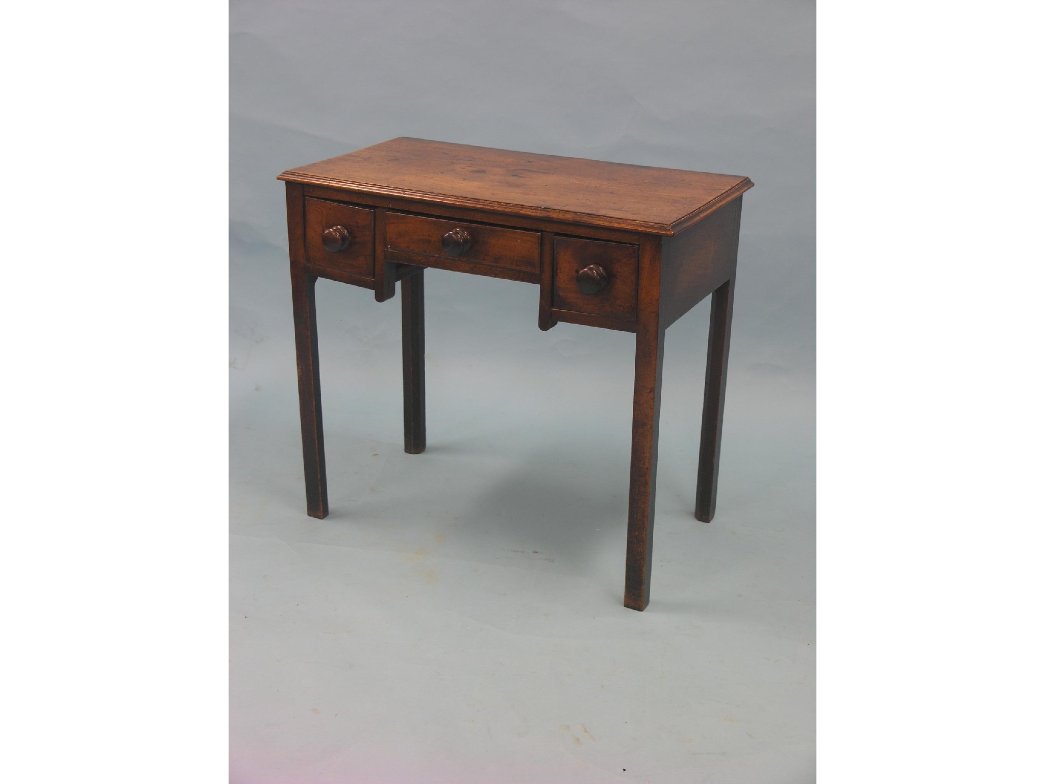 Appraisal: A Chippendale-period mahogany kneehole writing table three drawers on chamfered