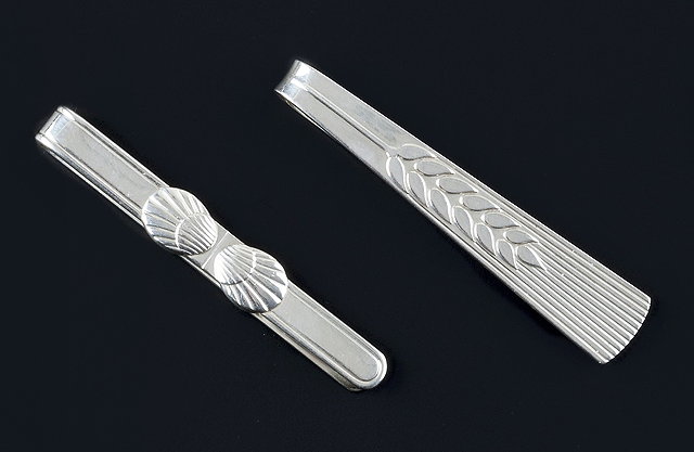 Appraisal: Two silver tie slides by Georg Jensen the first with