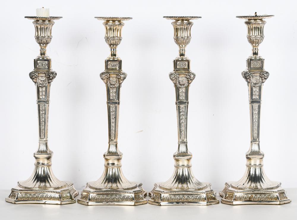 Appraisal: SET OF FOUR SILVERPLATE CANDLESTICKSEarly th century pseudo-marks to bases