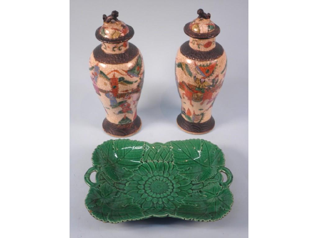 Appraisal: A pair of Chinese Famille rose baluster vases and covers