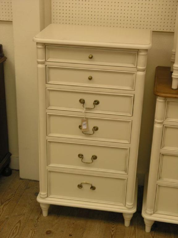 Appraisal: A Laura Ashley cream painted bedroom tallboy of six drawers