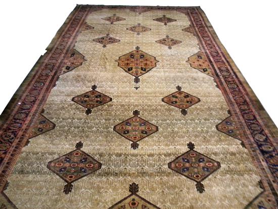 Appraisal: Antique Persian Sareb Hamadan palace-sized carpet tan ground with ten