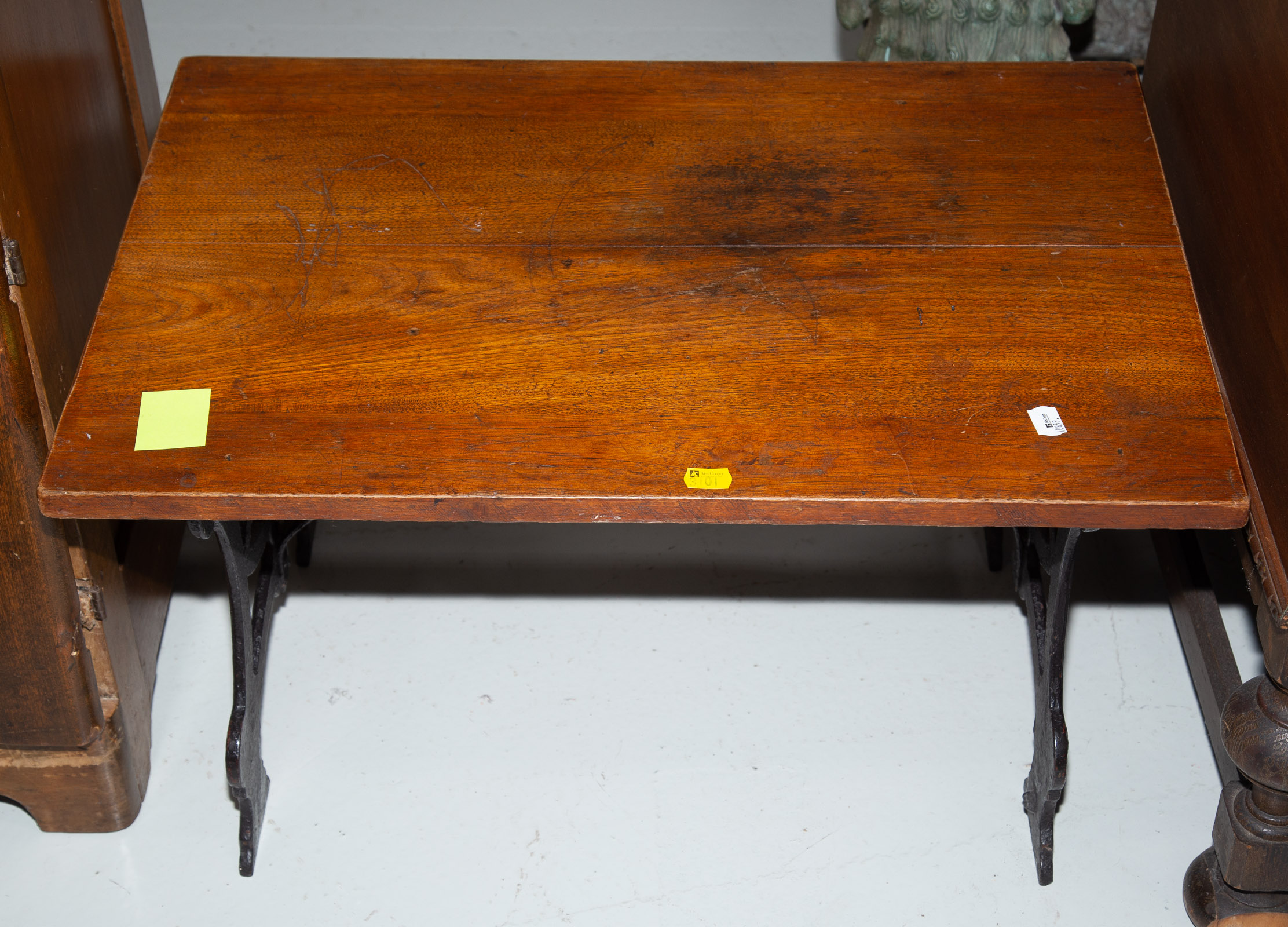 Appraisal: SMALL WALNUT CAST IRON TABLE Early th century in H