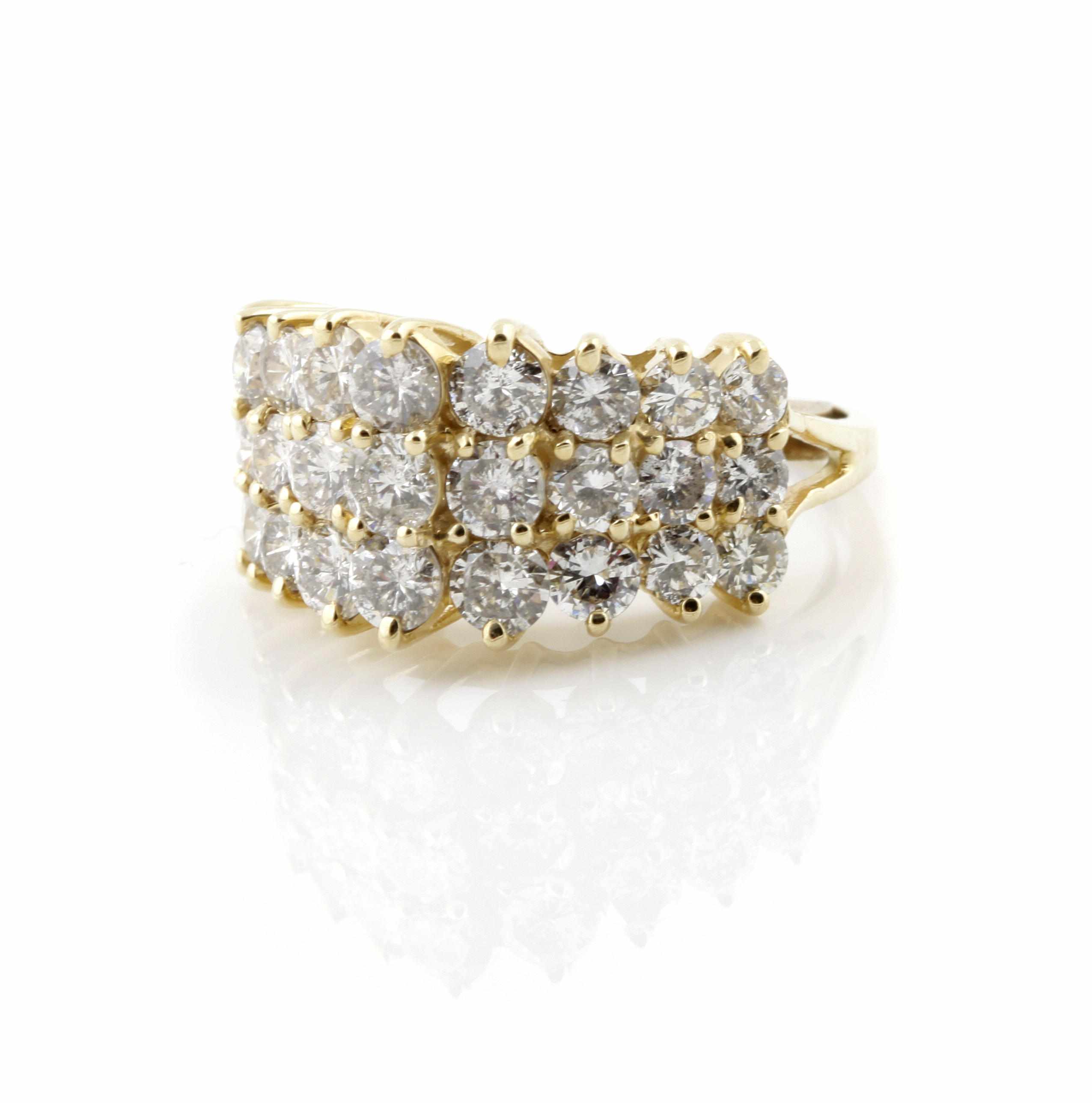 Appraisal: A diamond and gold dome ring estimated total diamond weight