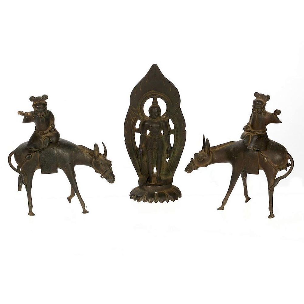 Appraisal: Two Chinese cast bronze horsemen and a Buddha A Pair