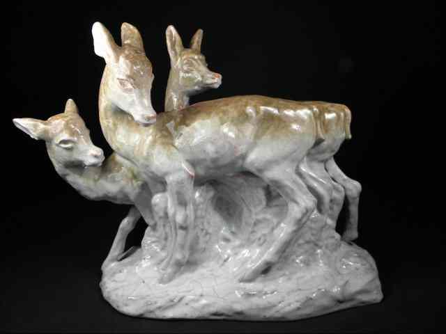 Appraisal: A continental hand painted pottery deer group Polychrome finish over