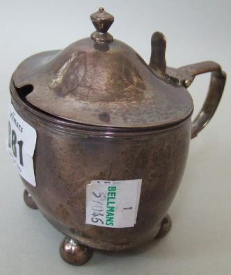 Appraisal: A silver oval hinge lidded mustard pot raised on four