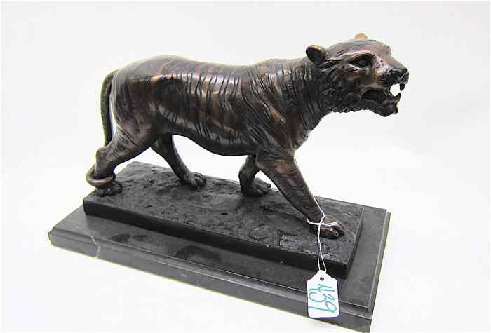 Appraisal: BRONZE WILDLIFE SCULPTURE a figure of a tiger having light