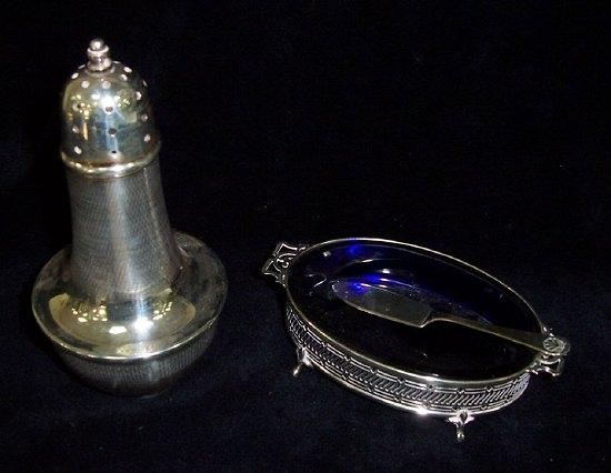 Appraisal: A sugar caster of baluster form with engine turned decoration