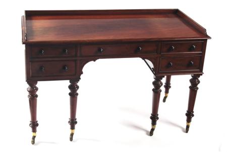 Appraisal: An adapted Victorian mahogany kneehole desk the moulded rectangular top