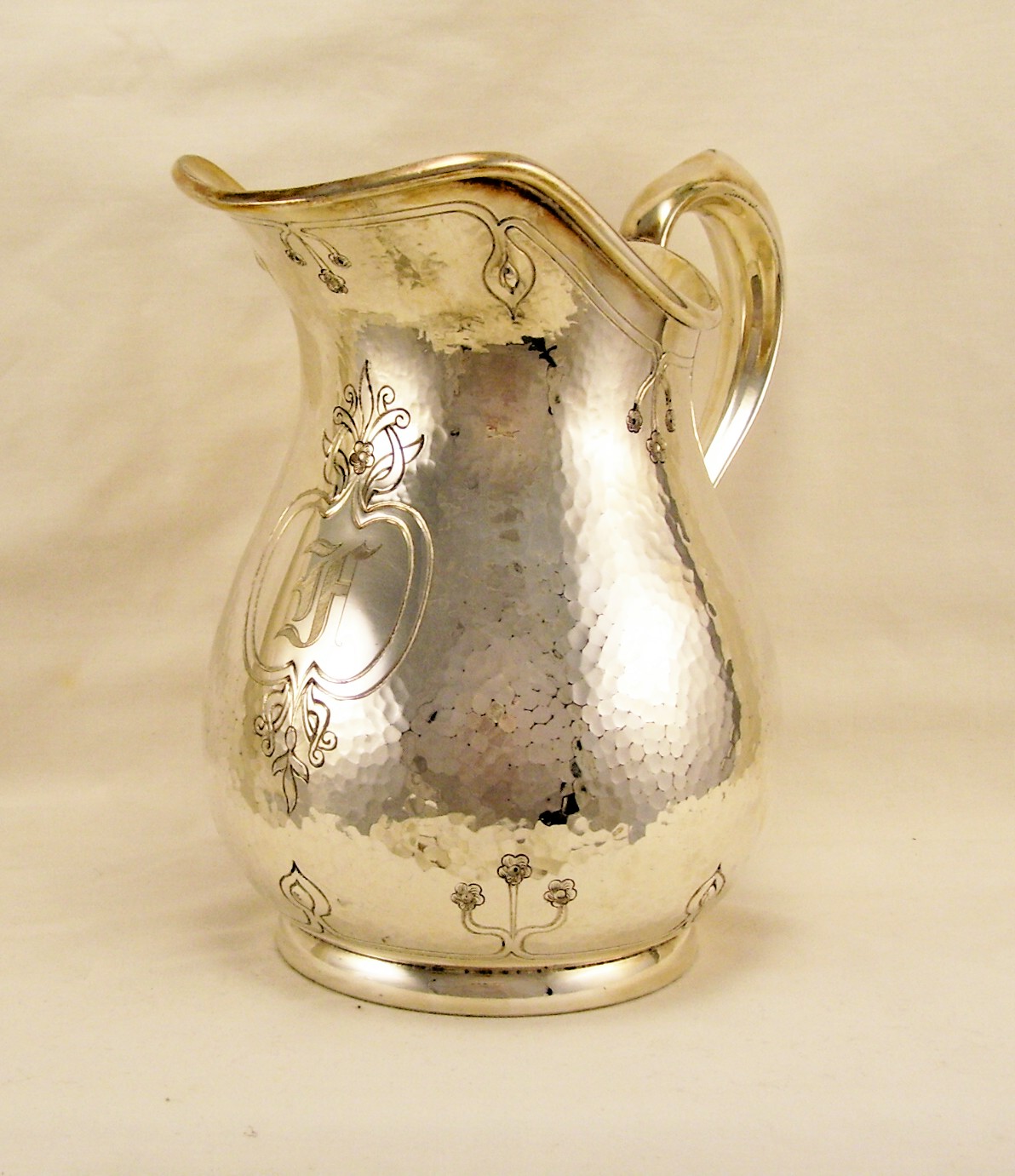 Appraisal: Reed Barton Silverplate Pitcher Hammered surface silverplated water pitcher with