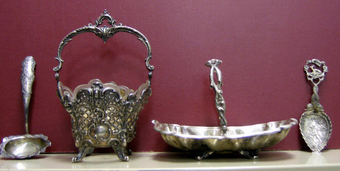 Appraisal: FOUR PIECES GERMAN-POLISH SILVER Two footed baskets one pierced with