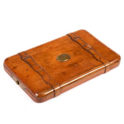 Appraisal: A Victorian beech wood manicure case with carved 'straps' the