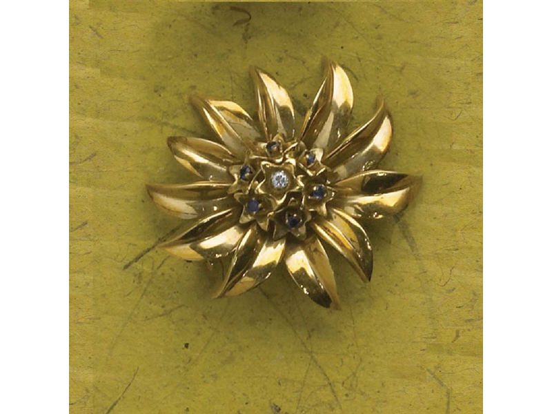 Appraisal: GOLD AND DIAMOND SUNFLOWER BROOCH With one diamond and six