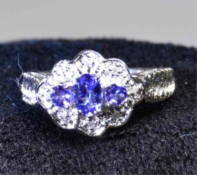 Appraisal: A Ladies K Tanzanite And Diamond RingThree central Tanzanite stones