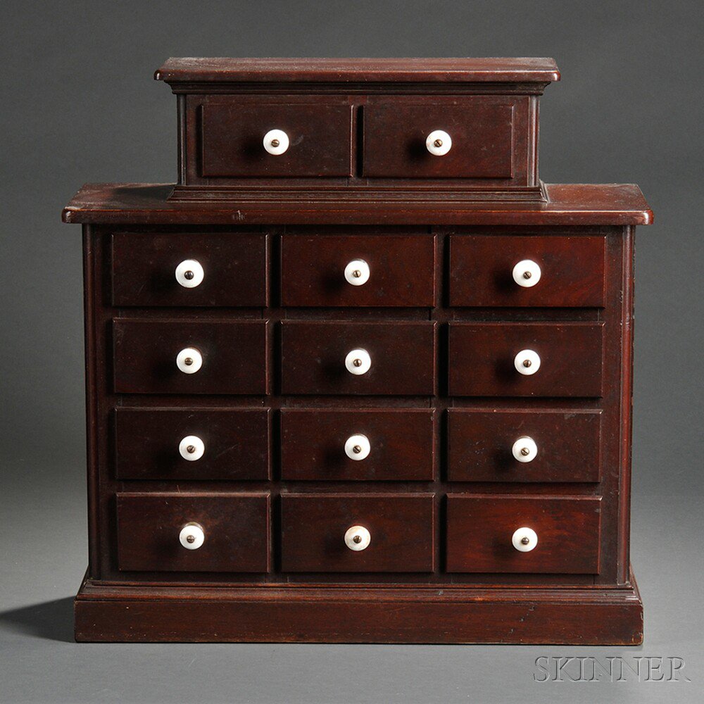 Appraisal: Small Walnut Chest of Fourteen Drawers America late th century