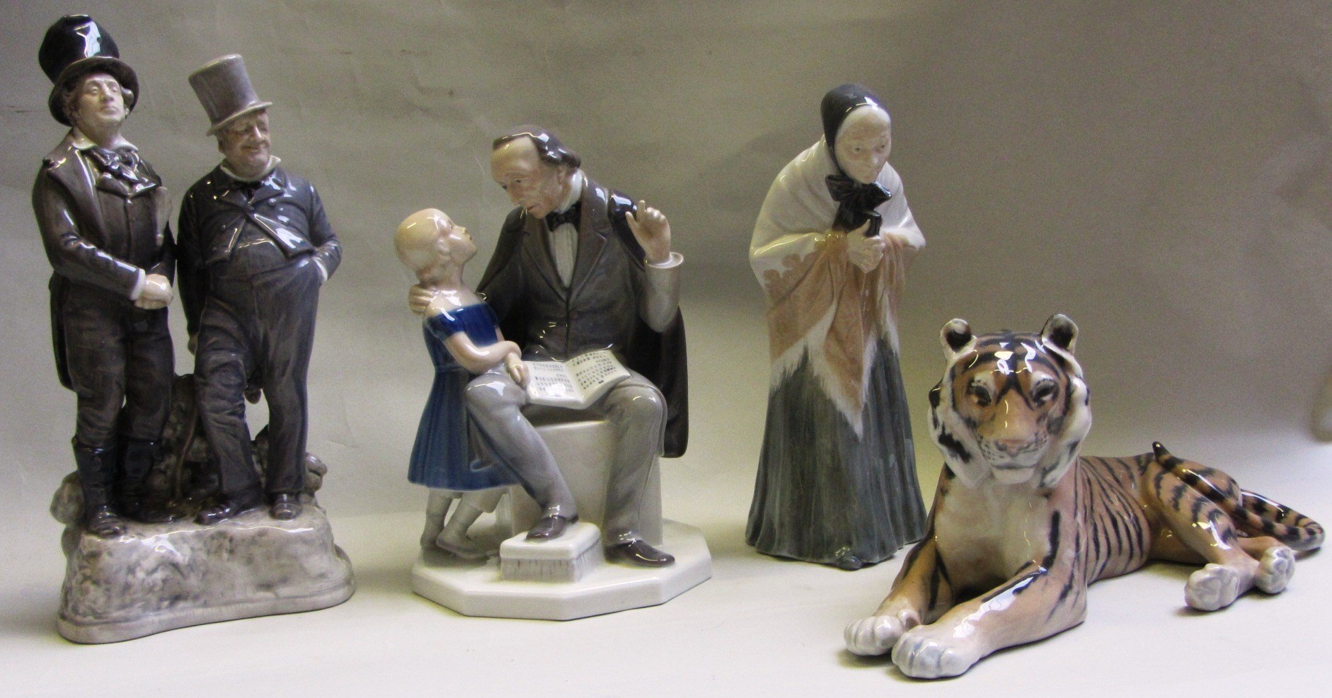 Appraisal: A Royal Copenhagen figure group modelled as a music teacher