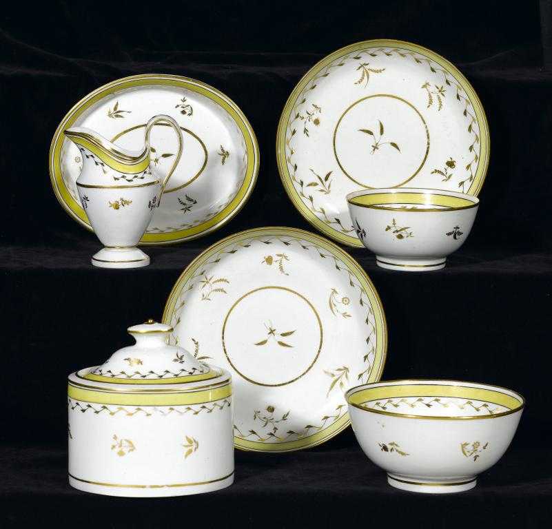 Appraisal: A THOMAS WOLFE PART TEA SERVICE gilt with sprigs in