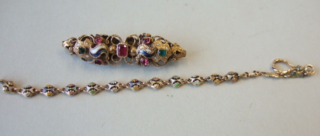 Appraisal: A gold and enamelled chain in a pierced quatrefoil shaped