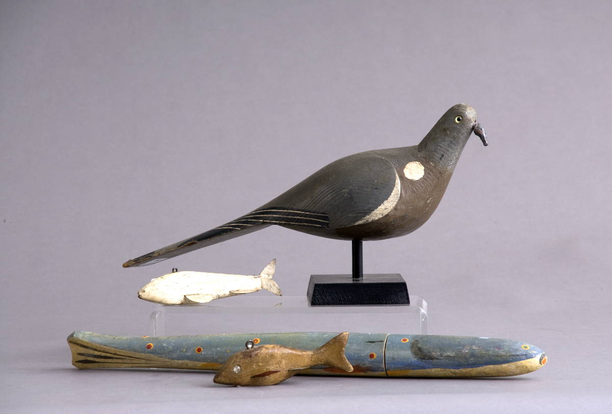 Appraisal: CARVED AND PAINTED PIGEON DECOY AND THREE FISH Length of