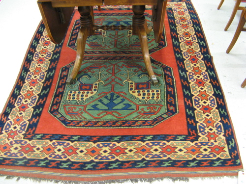 Appraisal: PERSIAN TRIBAL AREA RUG double octagonal medallion design on red