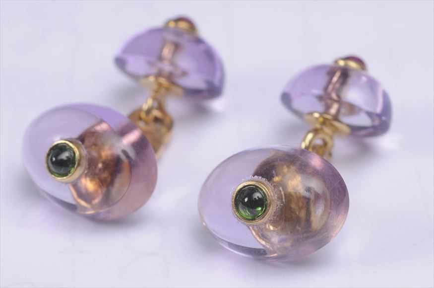 Appraisal: PAIR OF AMETHYST EMERALD RUBY AND GOLD CUFFLINKS Stamped k