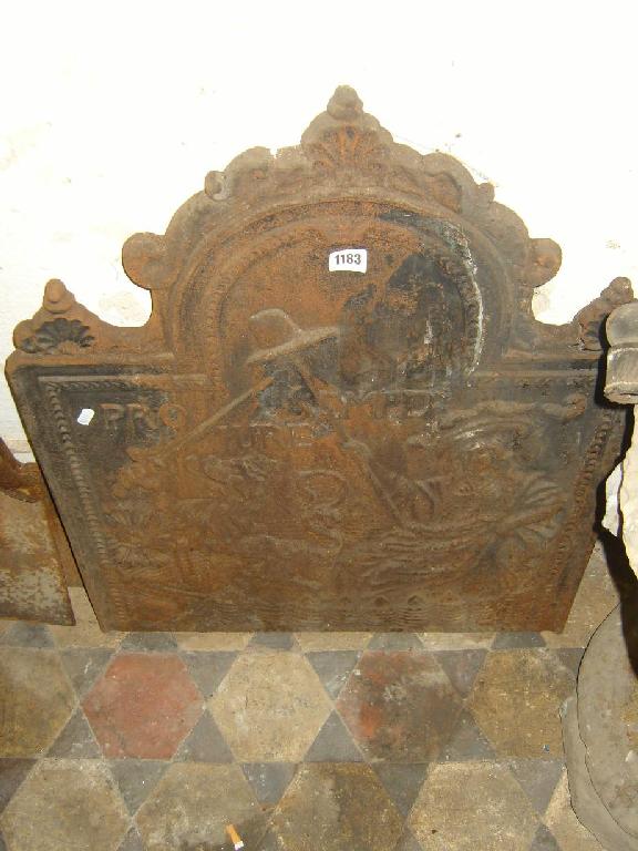 Appraisal: A Georgian cast iron fire back with relief decoration