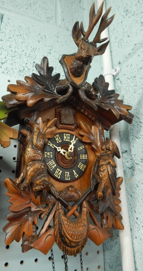 Appraisal: A Black Forest type cuckoo clock mounted with a bird