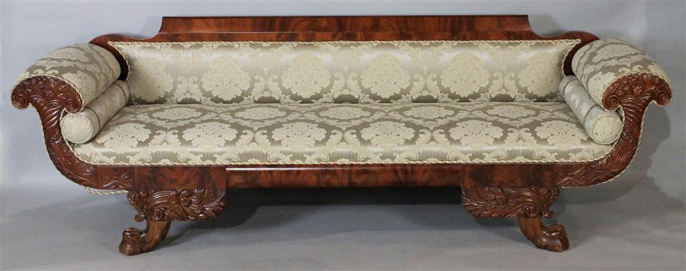 Appraisal: AMERICAN CLASSICAL STYLE MAHOGANY SOFA having a polished mahogany crest