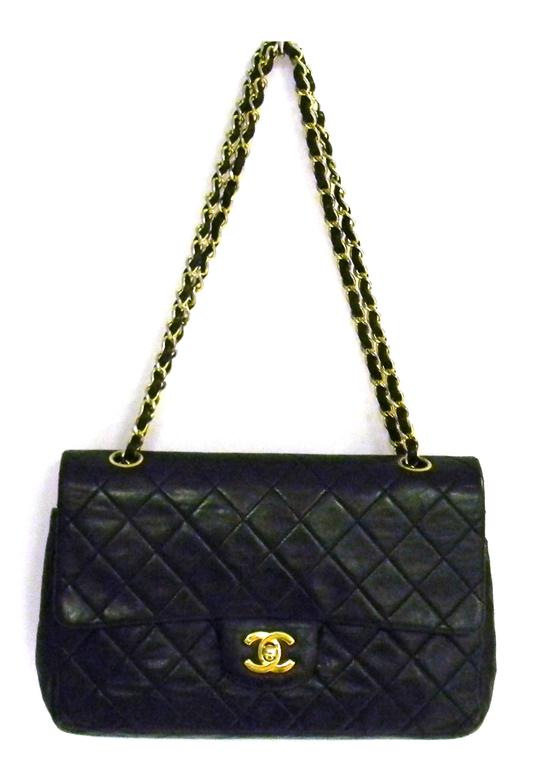 Appraisal: Chanel purse black quilted leather brick red interior double chain