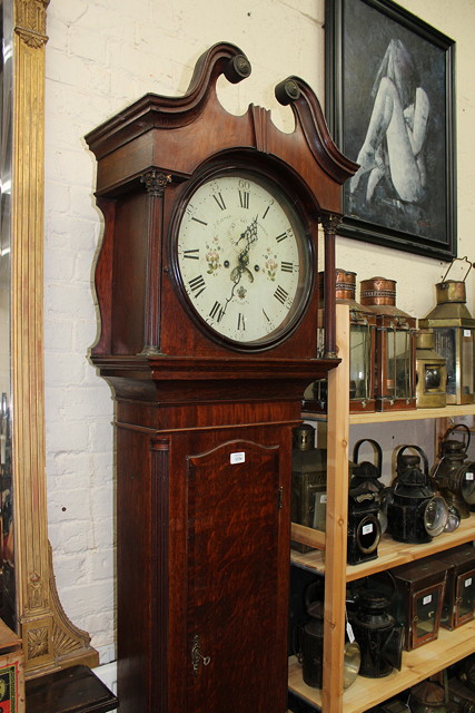 Appraisal: AN EIGHT DAY LONG CASE CLOCK the diameter enamel Roman