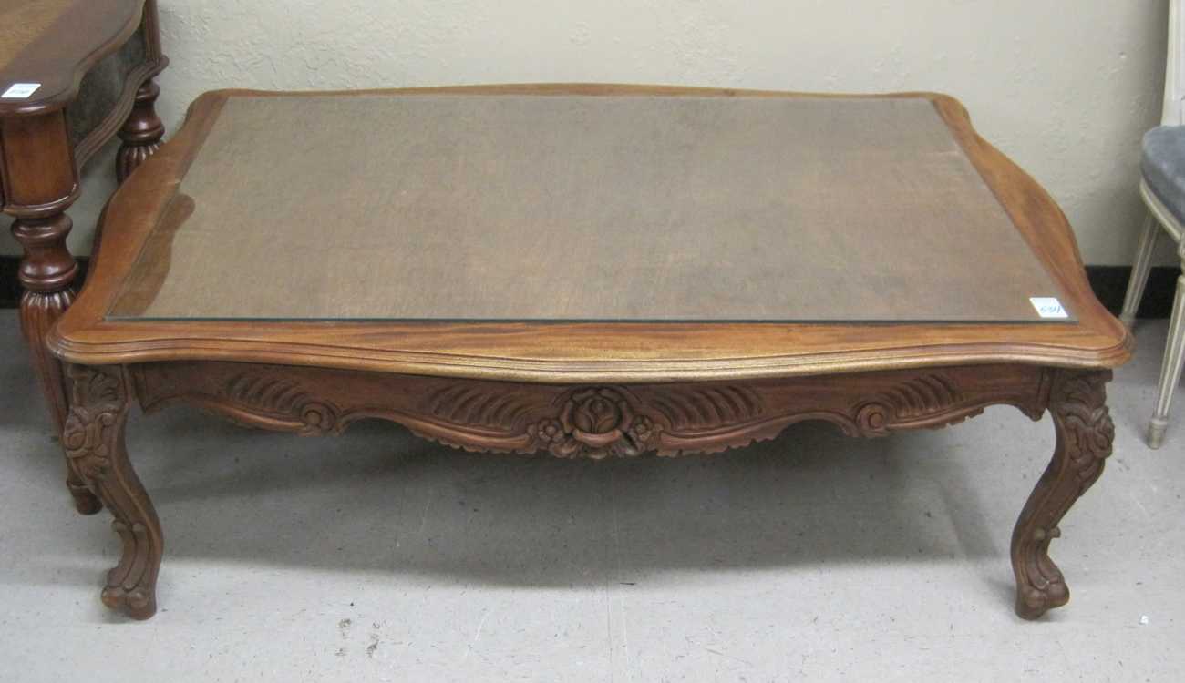 Appraisal: LOUIS XV STYLE COFFEE TABLE a rectangular carved mahogany table