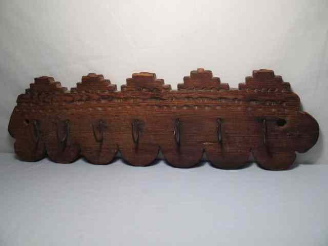 Appraisal: Antique American game fowl wall rack Carved wood design with