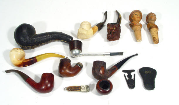 Appraisal: Seven Meerschaum and other smoker's pipes the bowl of one