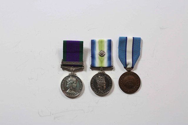 Appraisal: A GROUP OF THREE MEDALS awarded to Marine A S