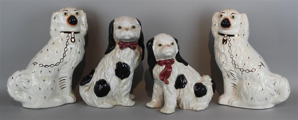 Appraisal: TWO PAIRS OF STAFFORDSHIRE SPANIELS one pair with gilt collars