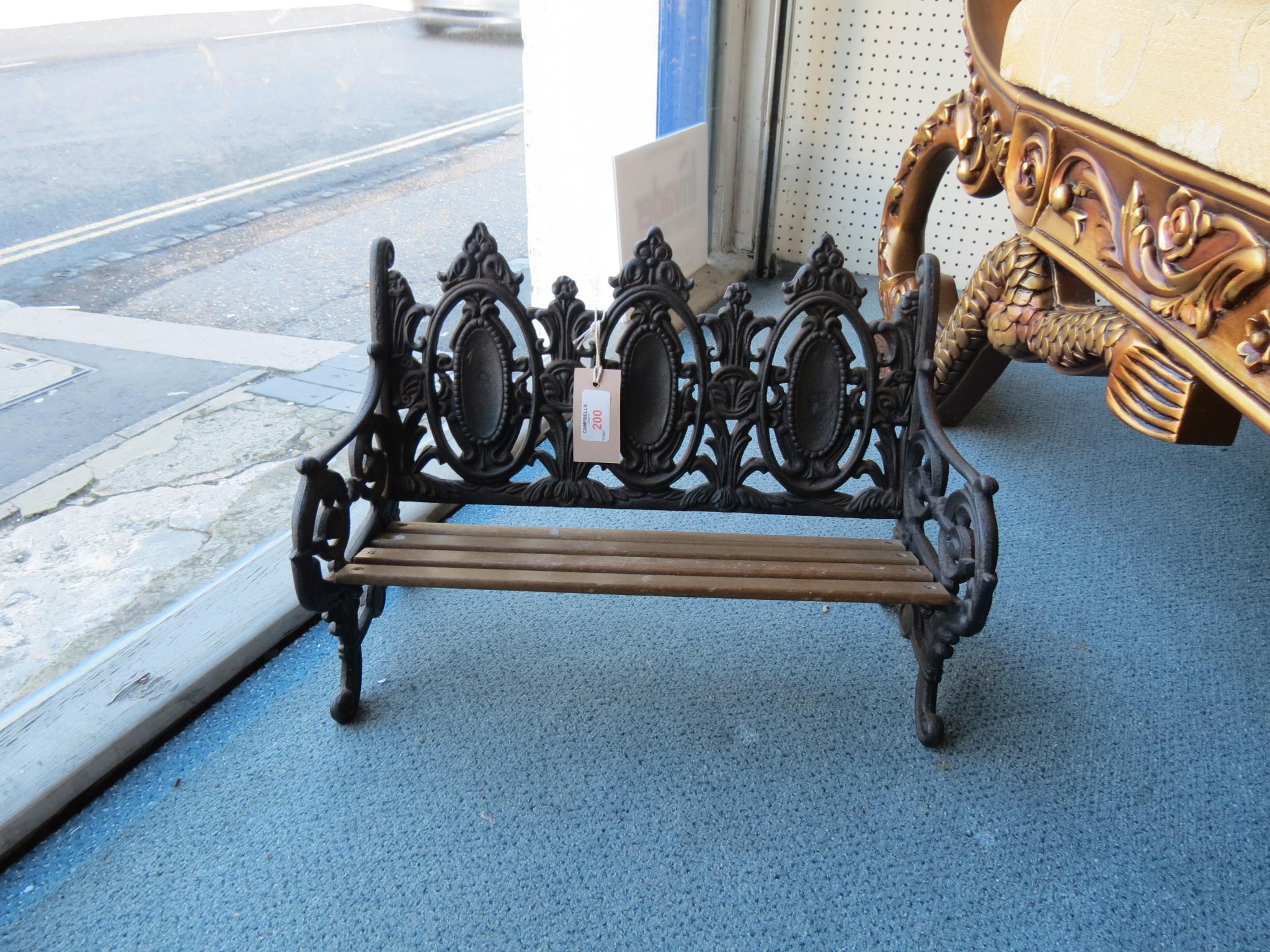 Appraisal: A Victorian-style miniature cast iron bench with slatted wood seat