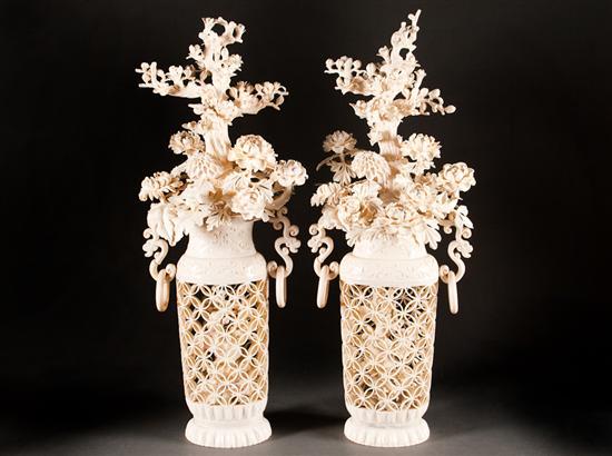 Appraisal: Pair of Chinese carved ivory urn-form vases of flowers with